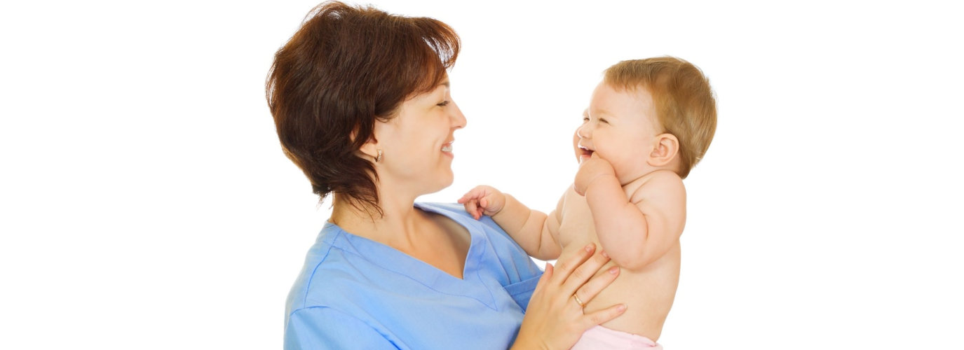 adult woman holding baby